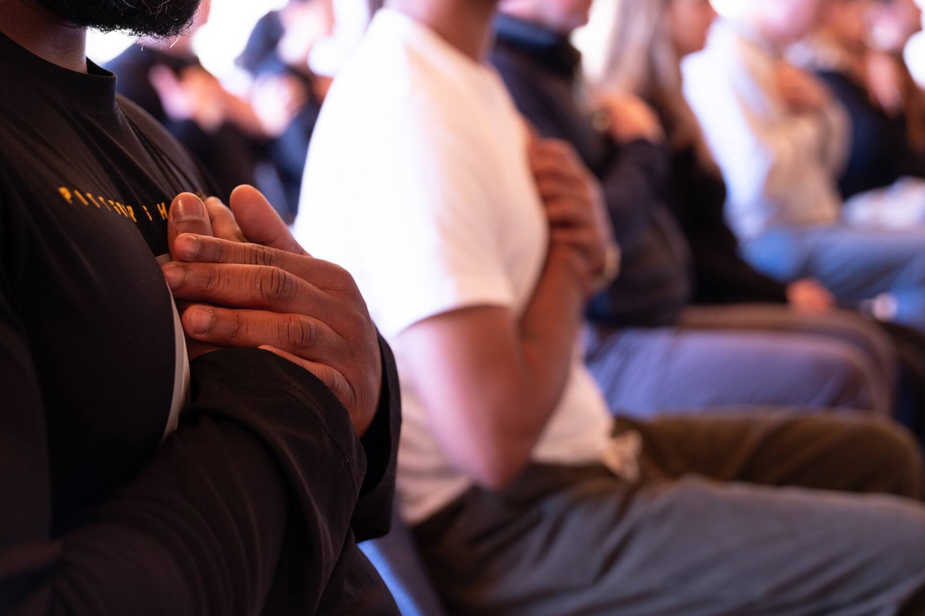 Hands resting at the heart during a Deepdive session