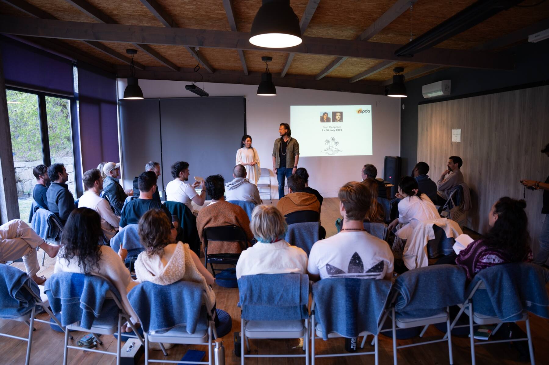 Group gathered in the Deepdive hall during a session