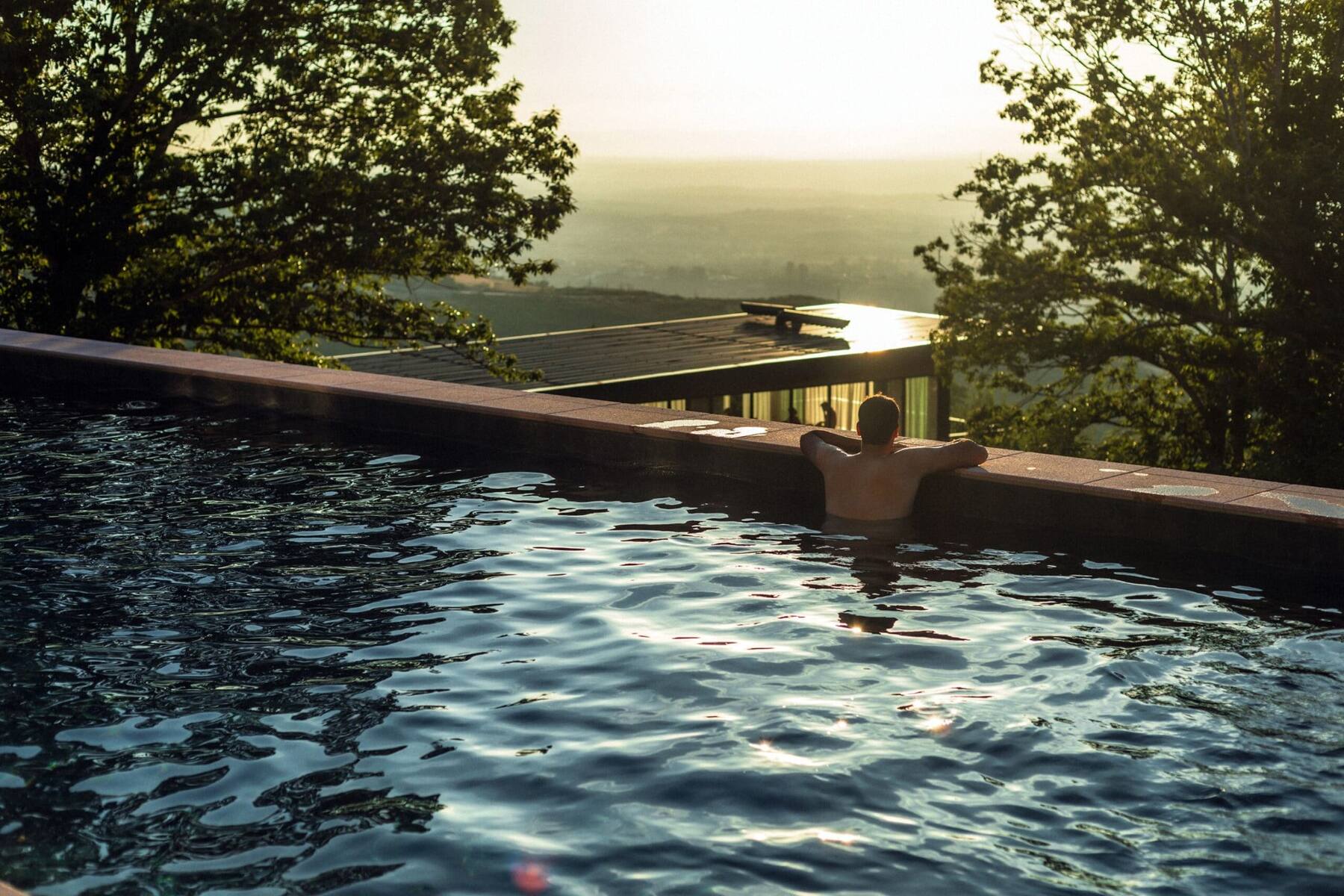 Infinity pool overlooking the valley at golden hour